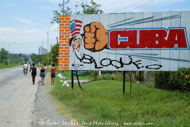 Political poster on a billboard showing Cuban resistance to the American embargo nearby Cienfuegos, Cuba.